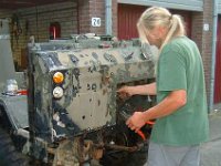 Arend is cutting away the wiring.It has to make room for a complete new wiringloom.