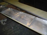 The 25 layers of military paint on the rear body sides were chemically stripped off. The panels look brand new now, not 31 years old!